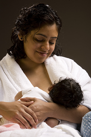 Mother breastfeeding infant.
