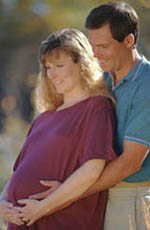 Picture of expectant parents, smiling